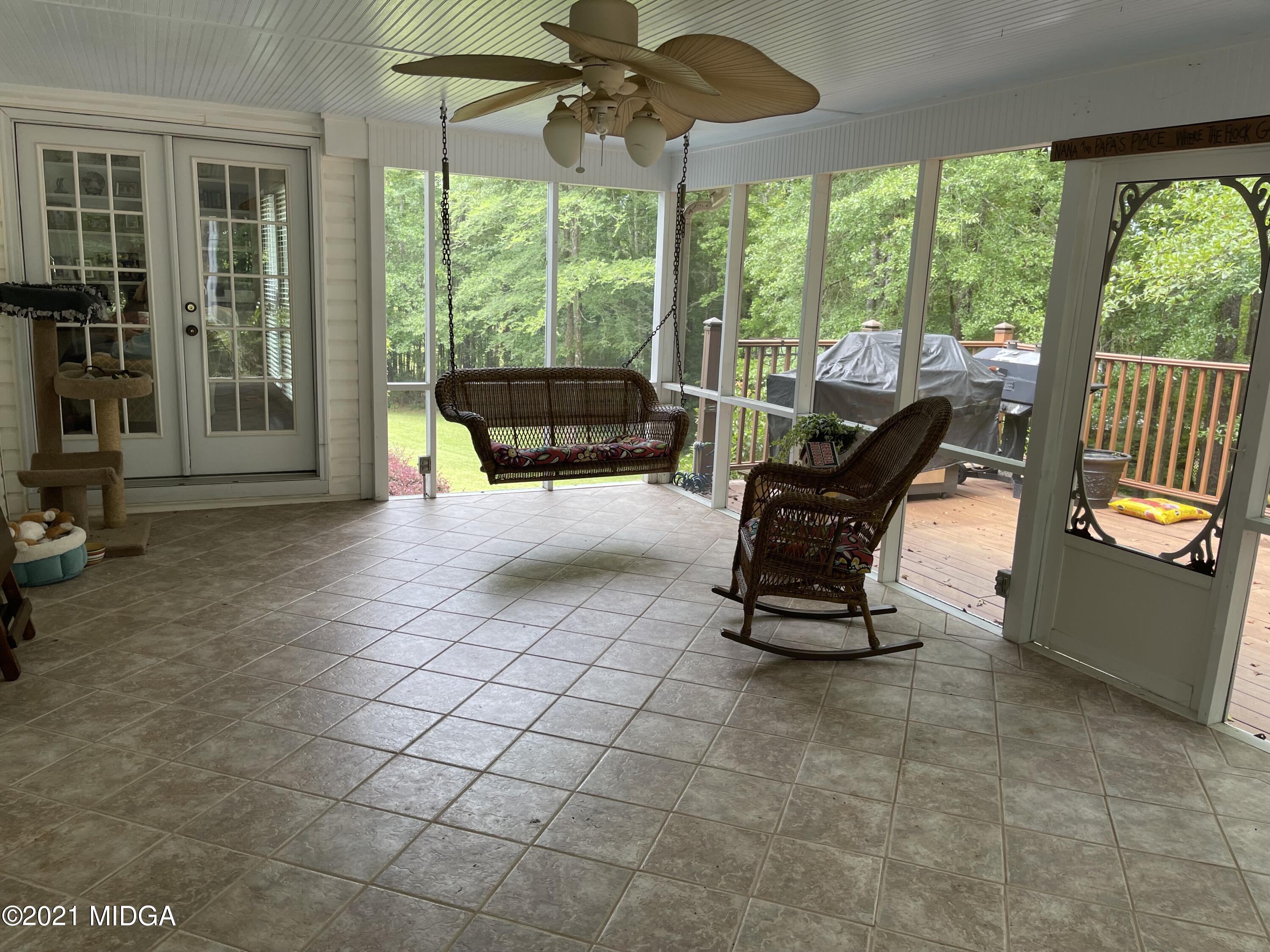 253 Ridge Crest Drive Macon, GA 31210 - Photo 12 of 16 a living room with furniture and a floor to ceiling window