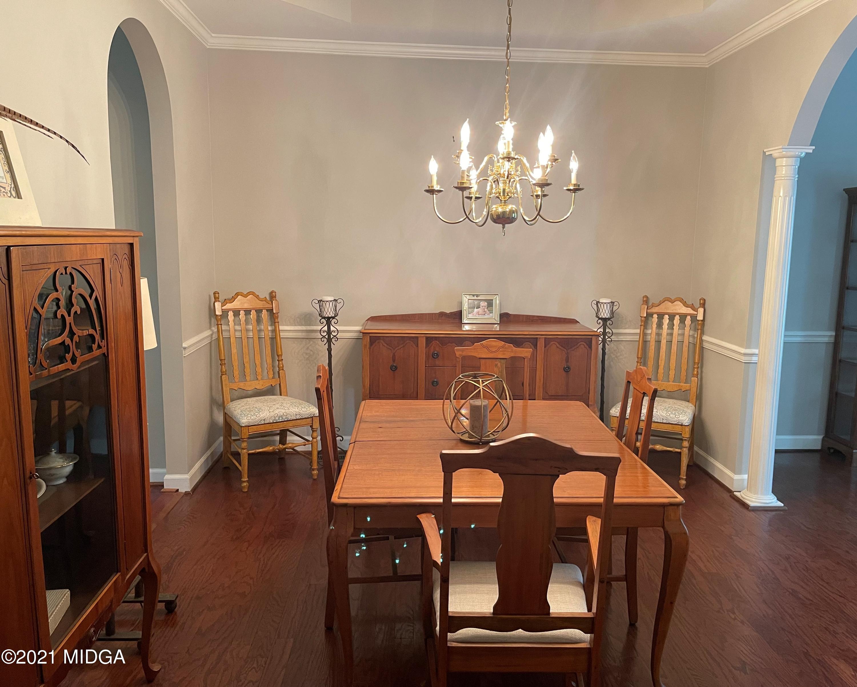 253 Ridge Crest Drive Macon, GA 31210 - Photo 4 of 16 a view of a dining room with furniture wooden floor and chandelier