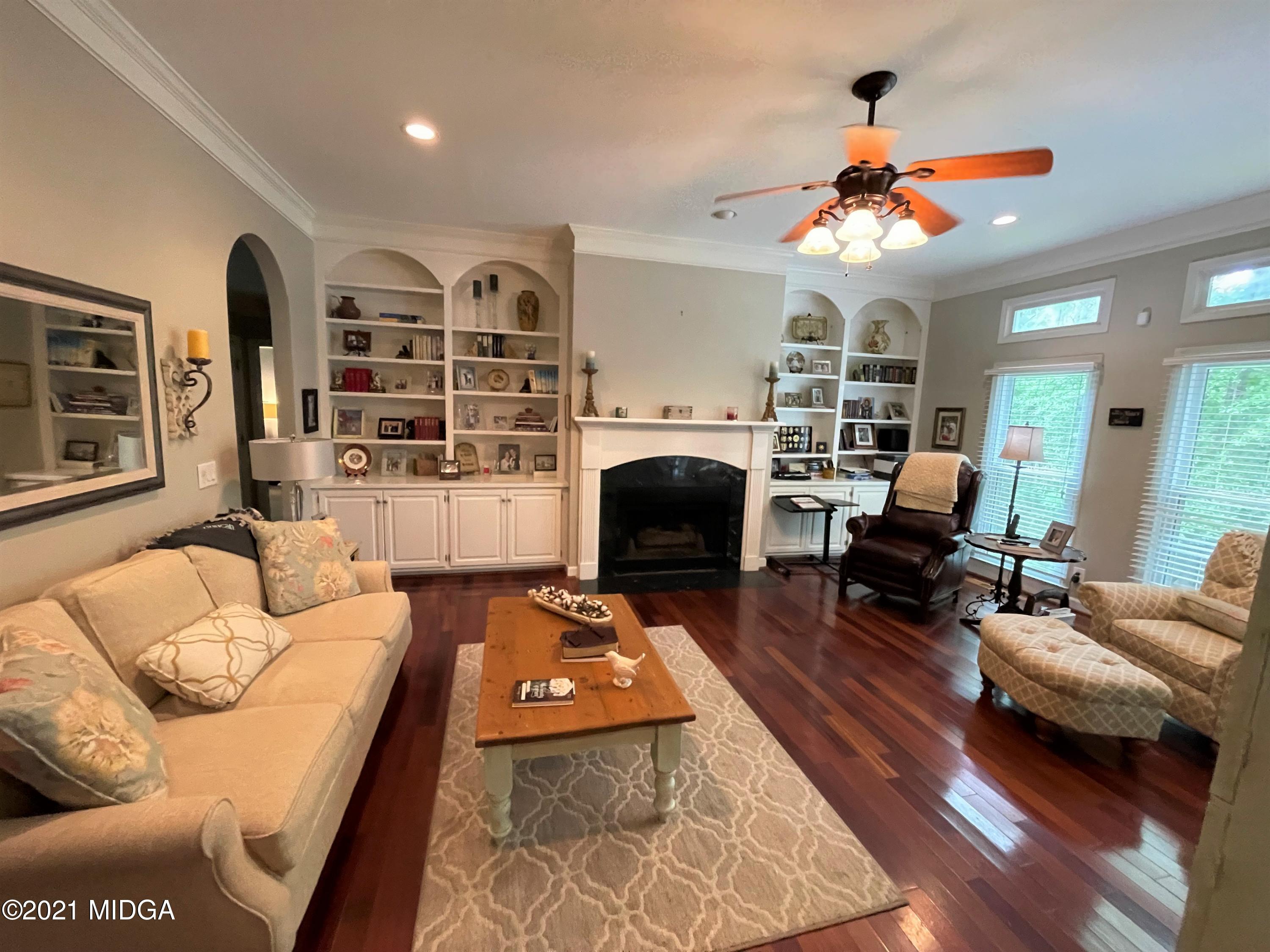 253 Ridge Crest Drive Macon, GA 31210 - Photo 7 of 16 a living room with furniture fireplace and flat screen tv