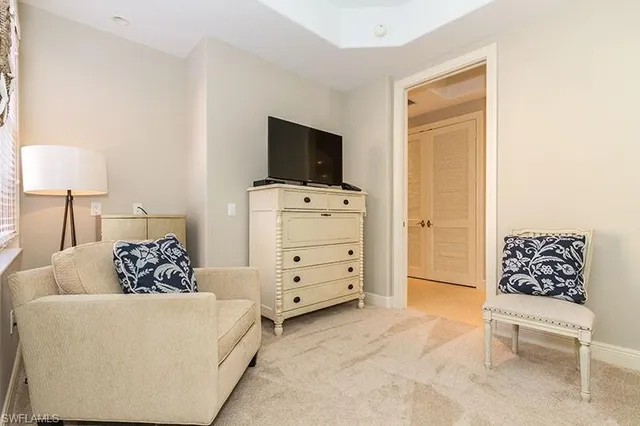 a room with furniture and a flat screen tv