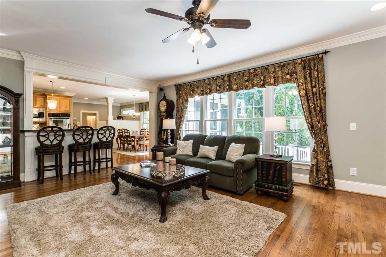 3413 Spartina Court Raleigh, NC 27606 - Photo 11 of 25 a living room with furniture and a large window