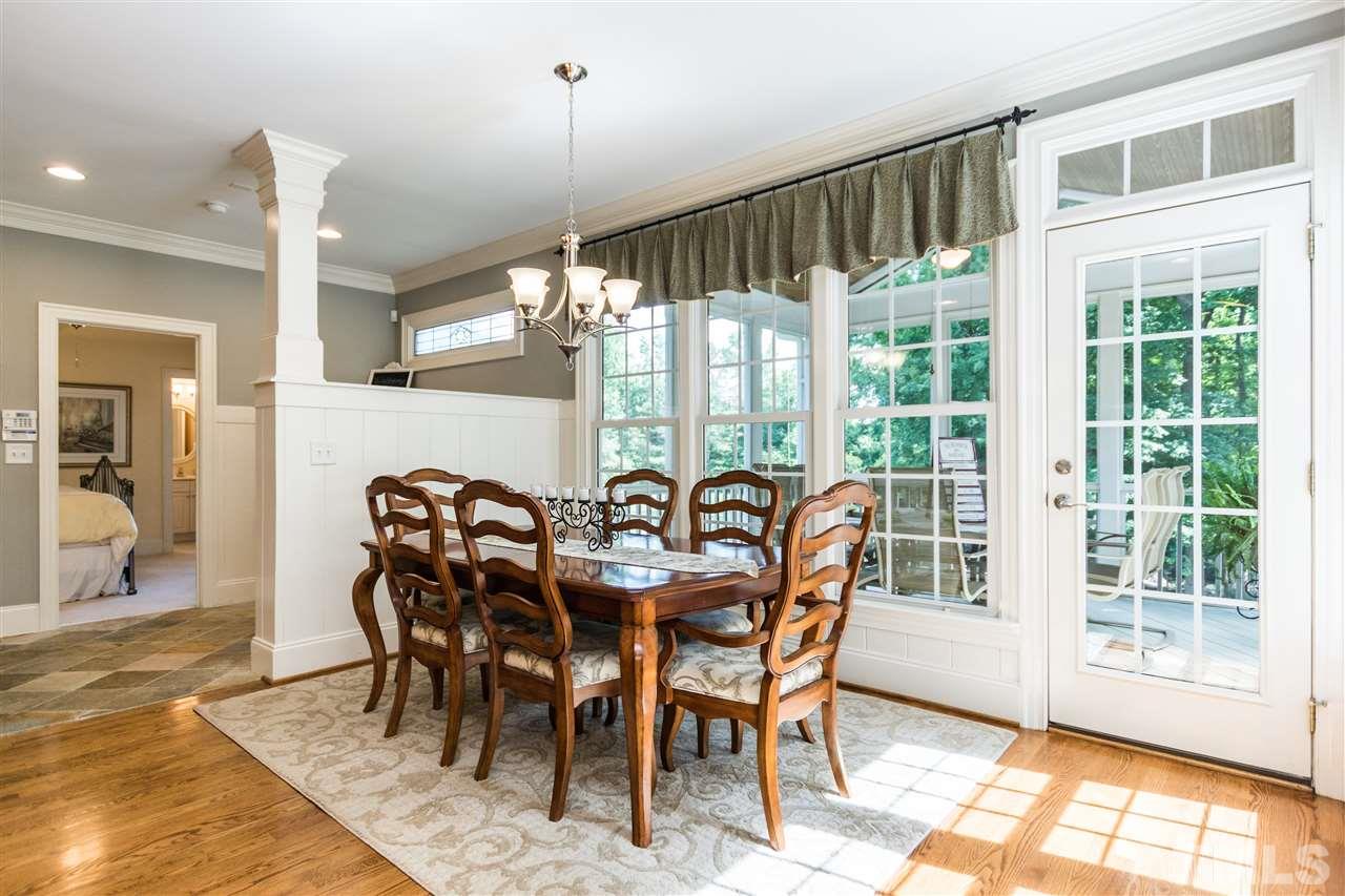 3413 Spartina Court Raleigh, NC 27606 - Photo 13 of 25 a view of a dining room with furniture window and wooden floor