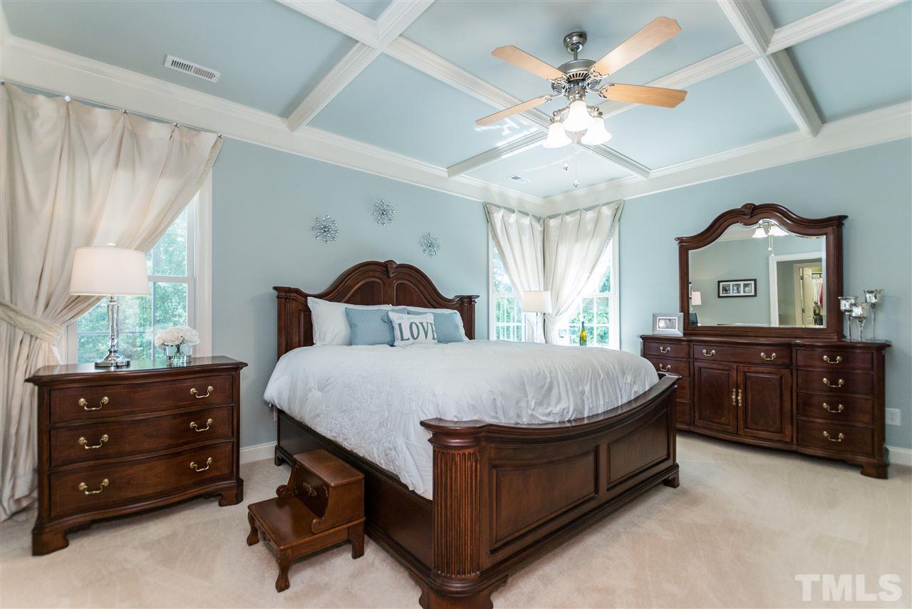3413 Spartina Court Raleigh, NC 27606 - Photo 15 of 25 a bed room with a bed and a dresser