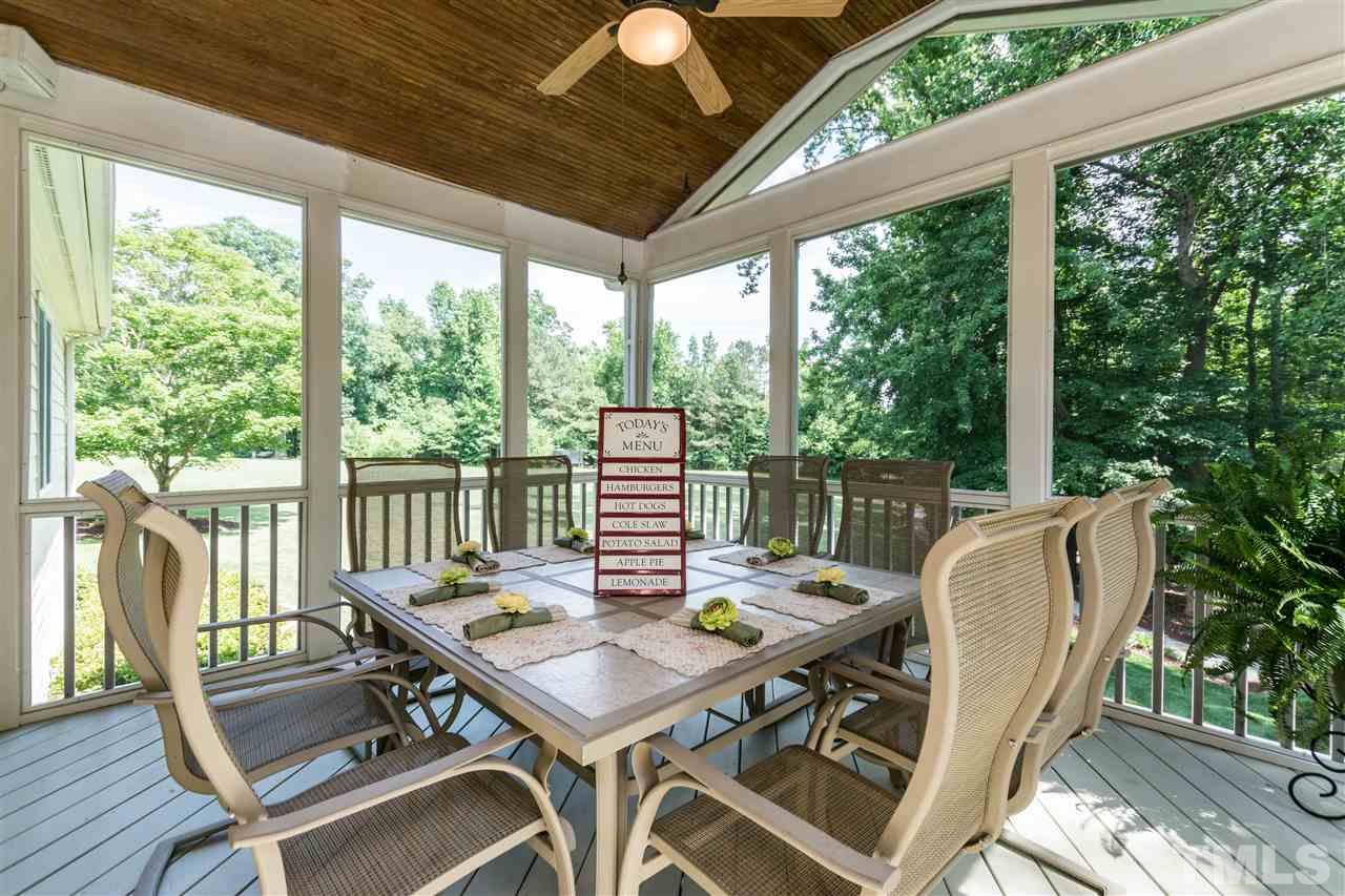 3413 Spartina Court Raleigh, NC 27606 - Photo 23 of 25 a view of a patio with a table chairs and a table
