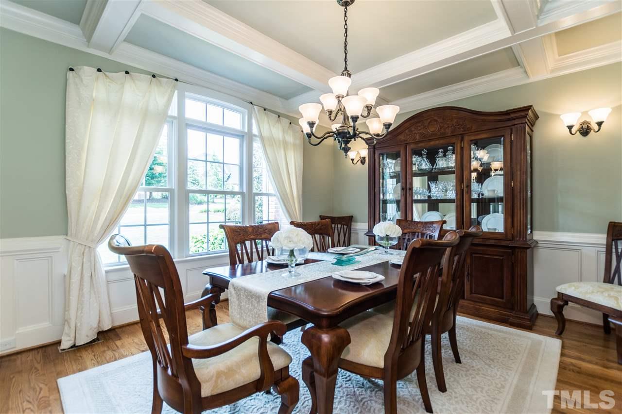 3413 Spartina Court Raleigh, NC 27606 - Photo 4 of 25 a view of a dining room with furniture window and wooden floor