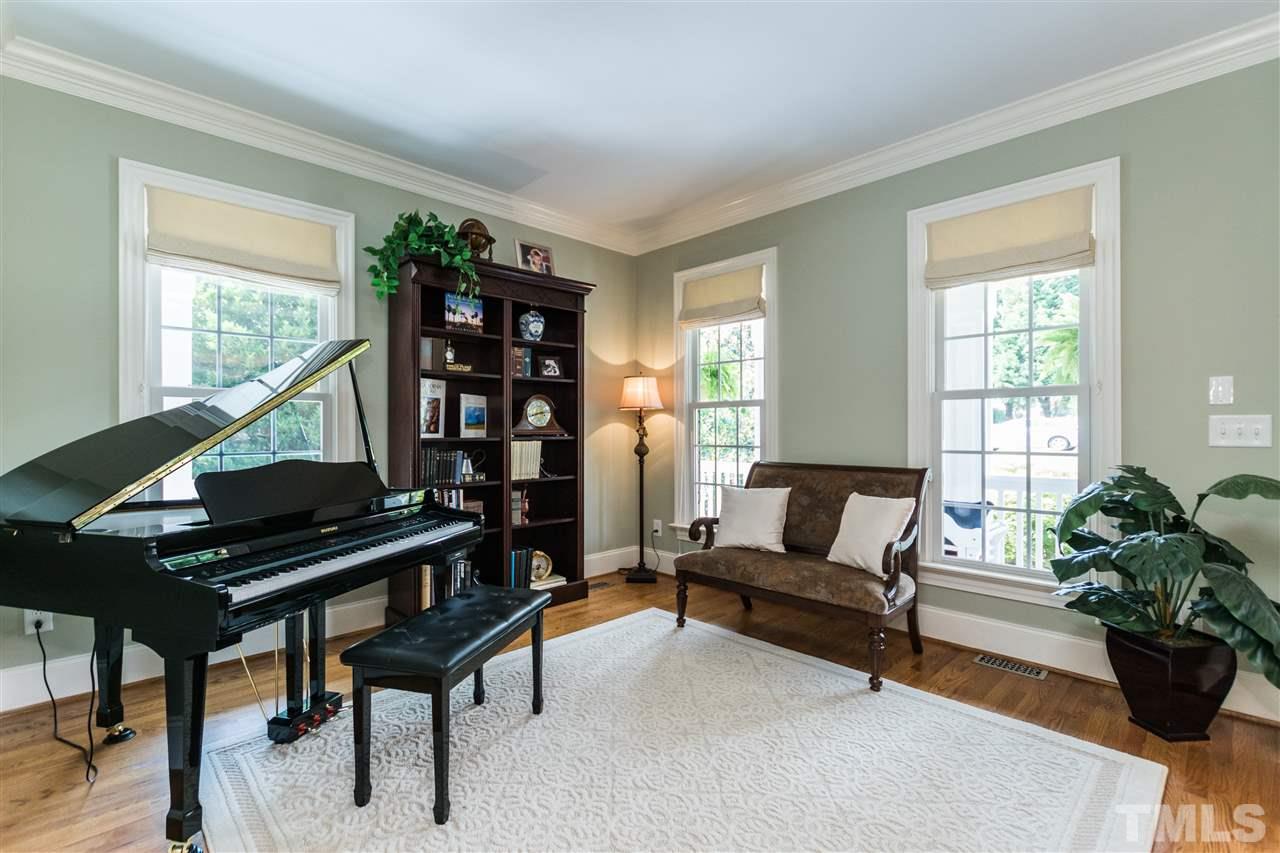 3413 Spartina Court Raleigh, NC 27606 - Photo 5 of 25 a living room with furniture and a window