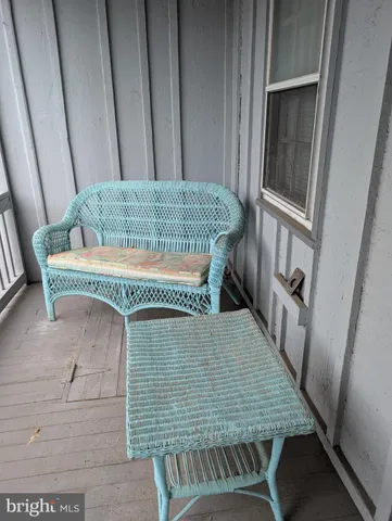 a view of balcony with furniture
