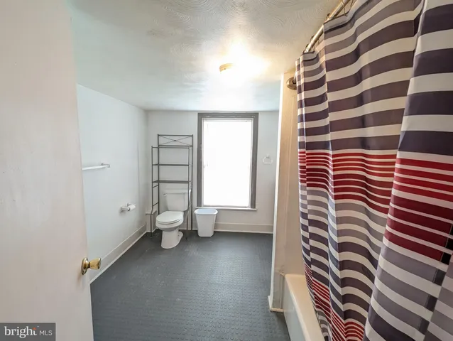 a view of bathroom with a sink and a shower