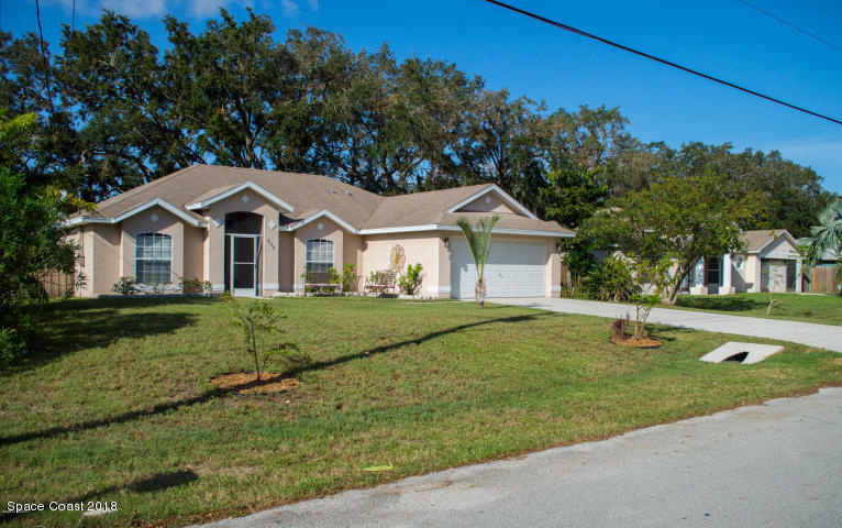 6130 Edison Street Cocoa, FL 32927 - Photo 3 of 15 a front view of a house with a yard