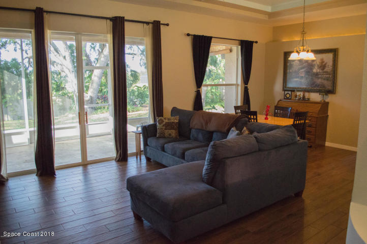 6130 Edison Street Cocoa, FL 32927 - Photo 4 of 15 a living room with furniture and a large window