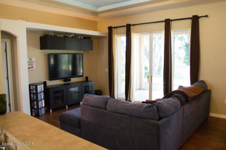 6130 Edison Street Cocoa, FL 32927 - Photo 5 of 15 a living room with furniture and a flat screen tv