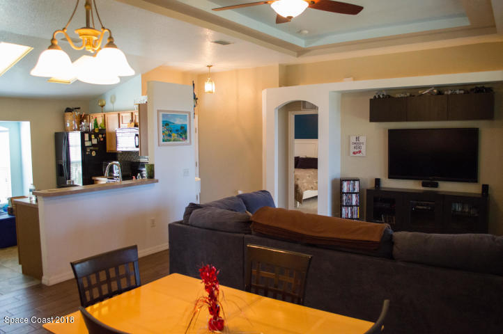 6130 Edison Street Cocoa, FL 32927 - Photo 6 of 15 a living room with furniture and a flat screen tv