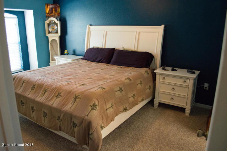6130 Edison Street Cocoa, FL 32927 - Photo 7 of 15 a bedroom with a bed and a dresser