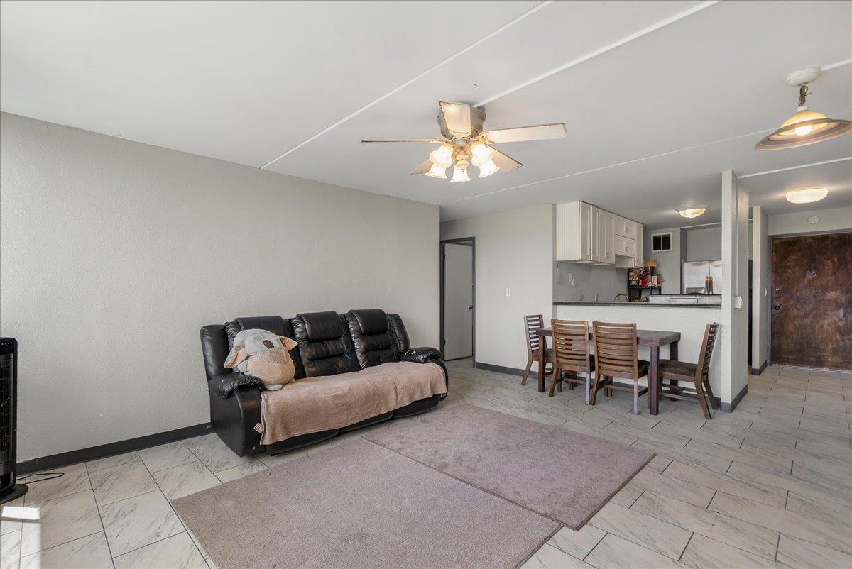 111 Kahului Beach Road, Unit B314 Kahului, HI 96732 - Photo 11 of 32 a living room with furniture and kitchen view