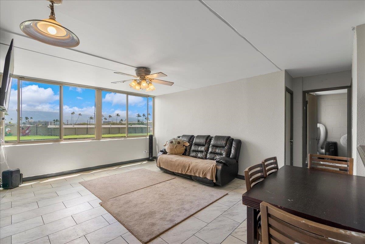 111 Kahului Beach Road, Unit B314 Kahului, HI 96732 - Photo 12 of 32 a living room with furniture and a large window