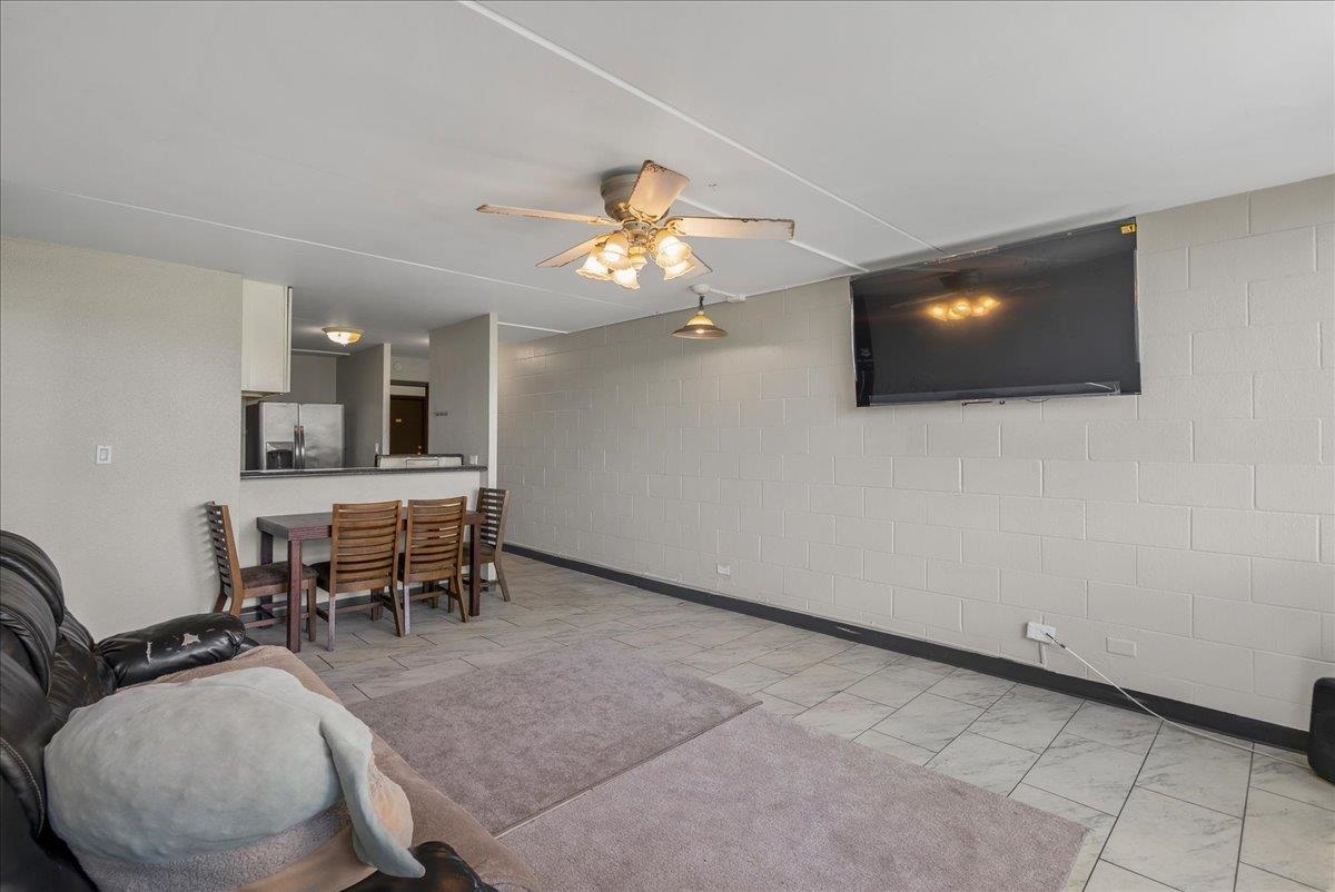 111 Kahului Beach Road, Unit B314 Kahului, HI 96732 - Photo 14 of 32 a living room with furniture and a flat screen tv