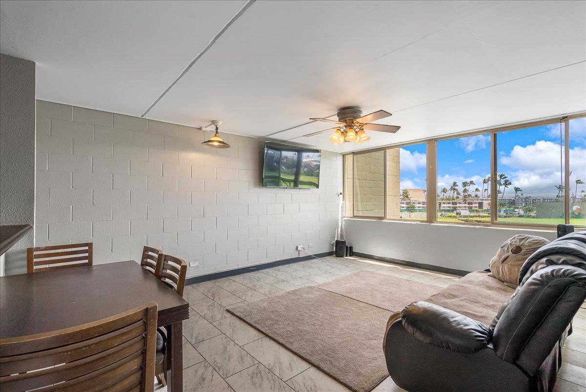 111 Kahului Beach Road, Unit B314 Kahului, HI 96732 - Photo 15 of 32 a living room with furniture and a large window