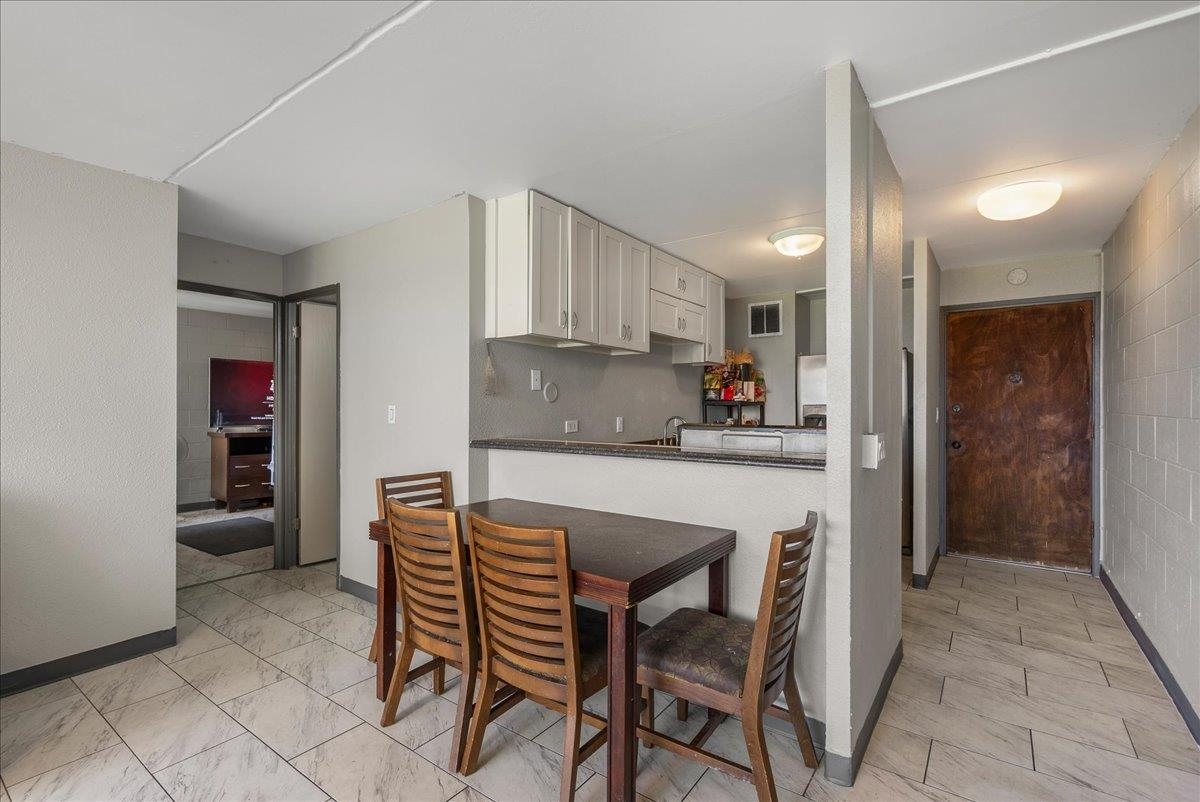 111 Kahului Beach Road, Unit B314 Kahului, HI 96732 - Photo 16 of 32 a kitchen with stainless steel appliances granite countertop a table and chairs in it