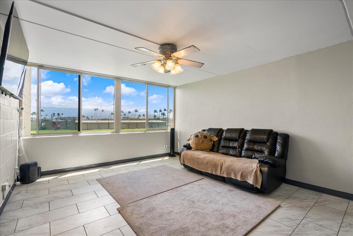 111 Kahului Beach Road, Unit B314 Kahului, HI 96732 - Photo 2 of 32 a living room with furniture and a large window