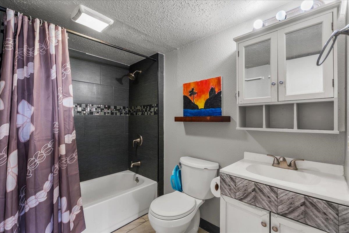 111 Kahului Beach Road, Unit B314 Kahului, HI 96732 - Photo 4 of 32 a bathroom with a sink a toilet and shower