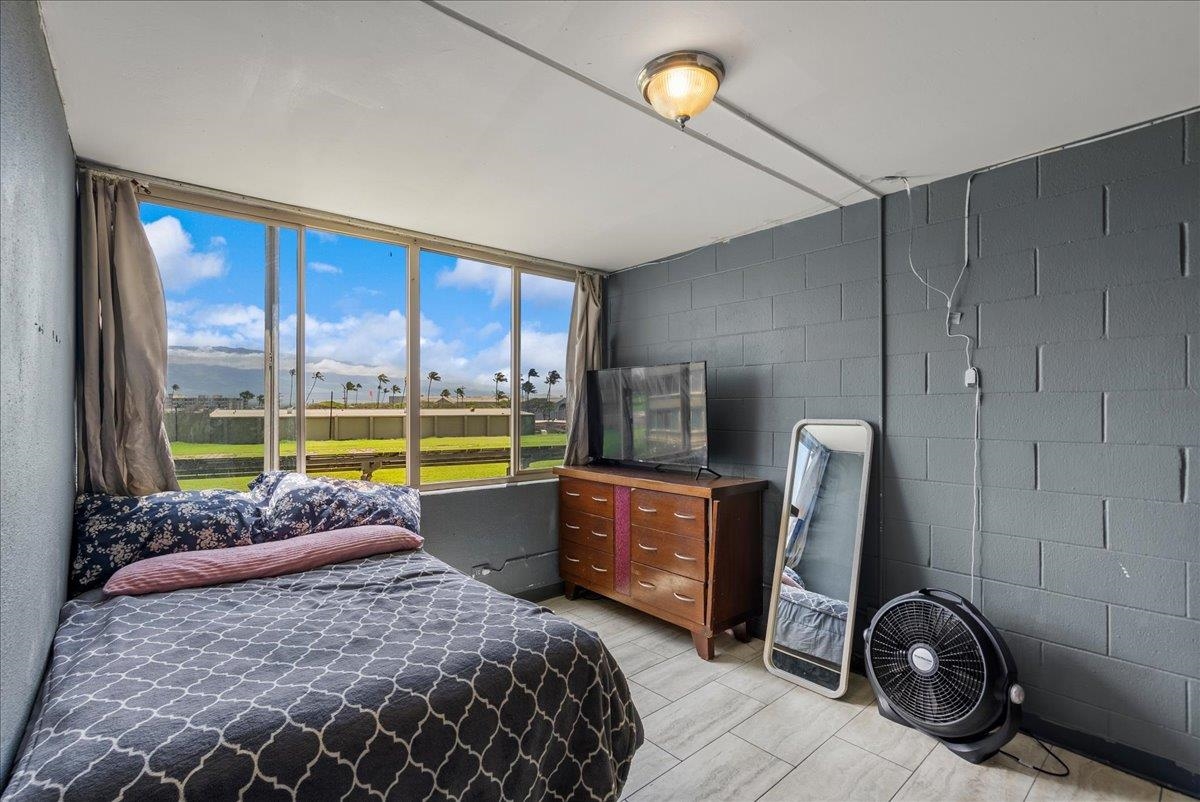 111 Kahului Beach Road, Unit B314 Kahului, HI 96732 - Photo 6 of 32 a bedroom with a bed and large window