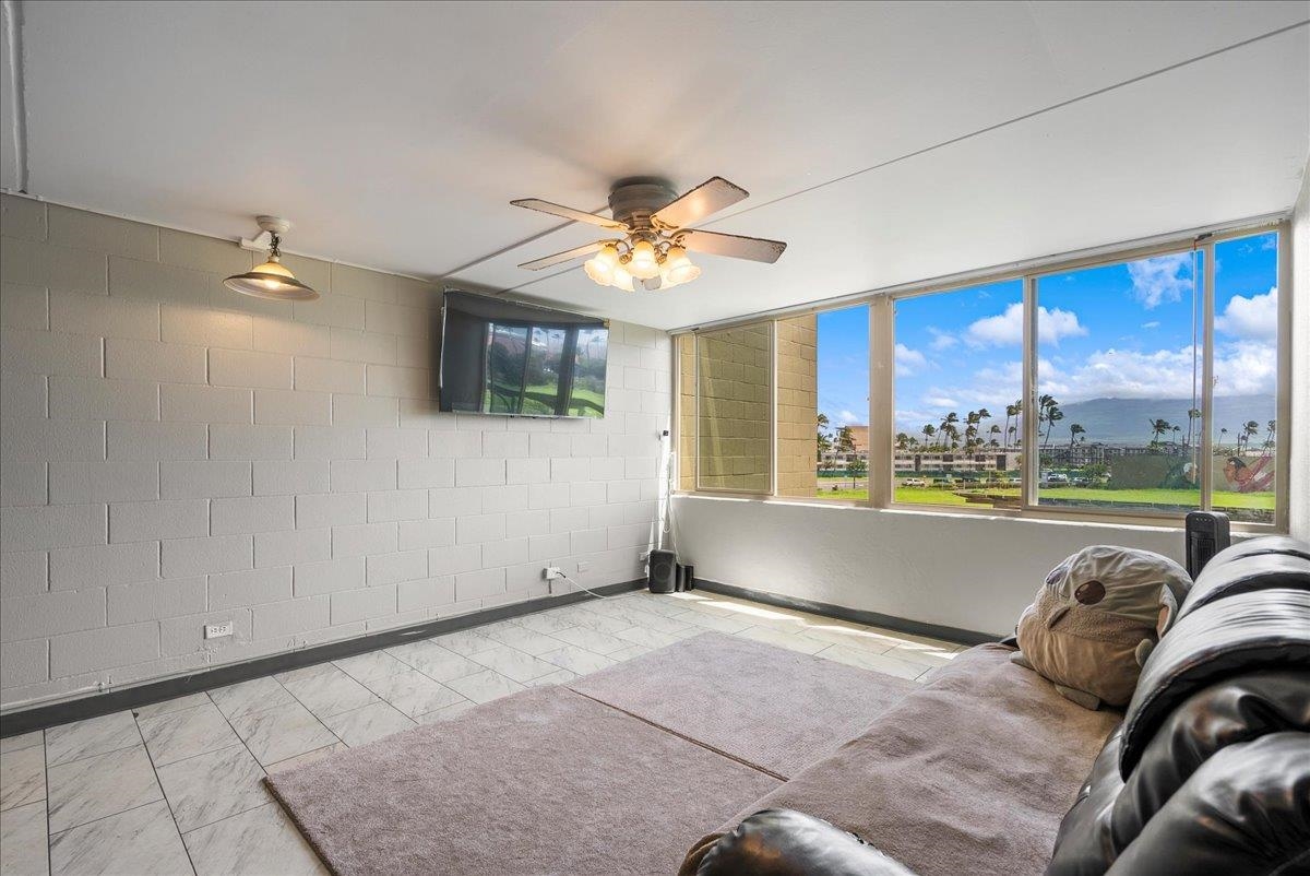 111 Kahului Beach Road, Unit B314 Kahului, HI 96732 - Photo 10 of 32 a view of a livingroom with furniture and chandelier fan