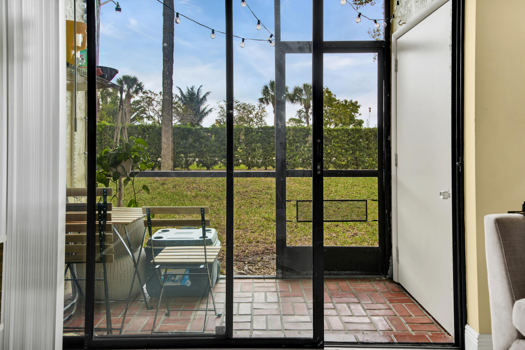6585 Somerset Drive, Unit 105 Boca Raton, FL 33433 - Photo 18 of 49 PATIO FROM LIVING ROOM