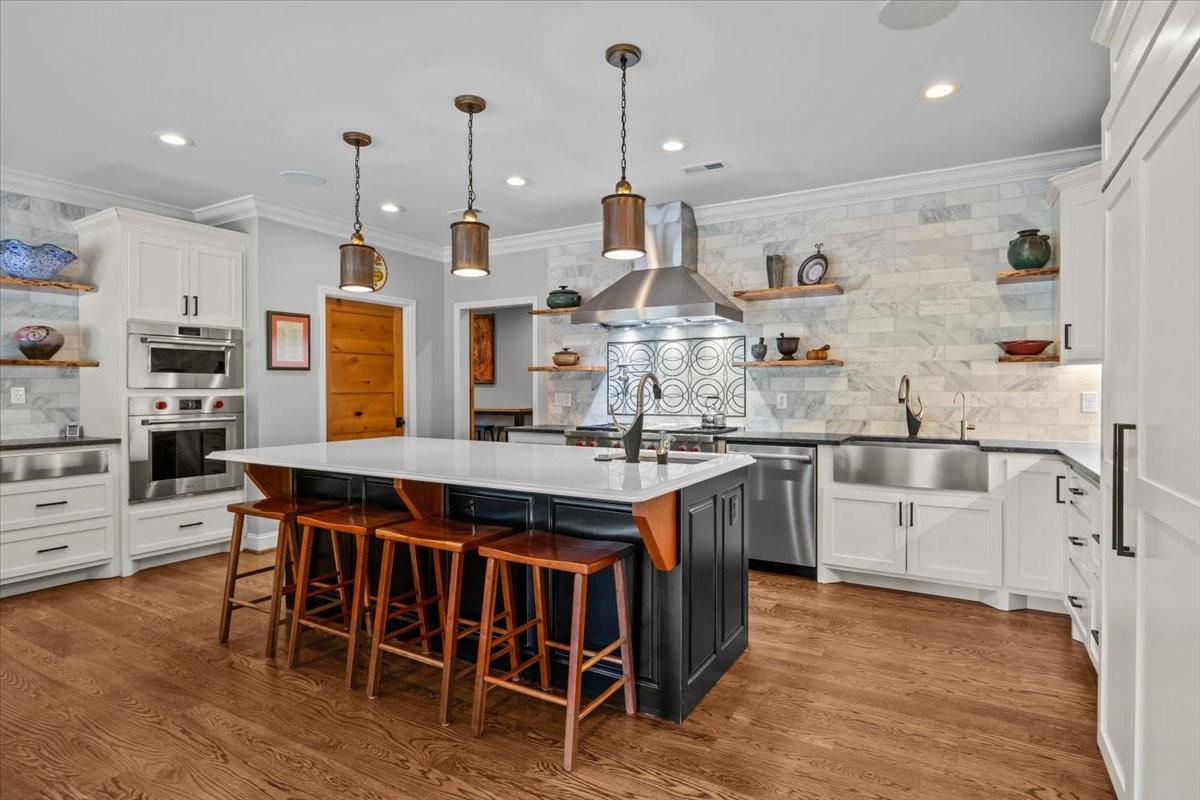 1355 Mitchell Road Pulaski, TN 38478 - Photo 15 of 95 a kitchen that has a lot of cabinets in it and appliances