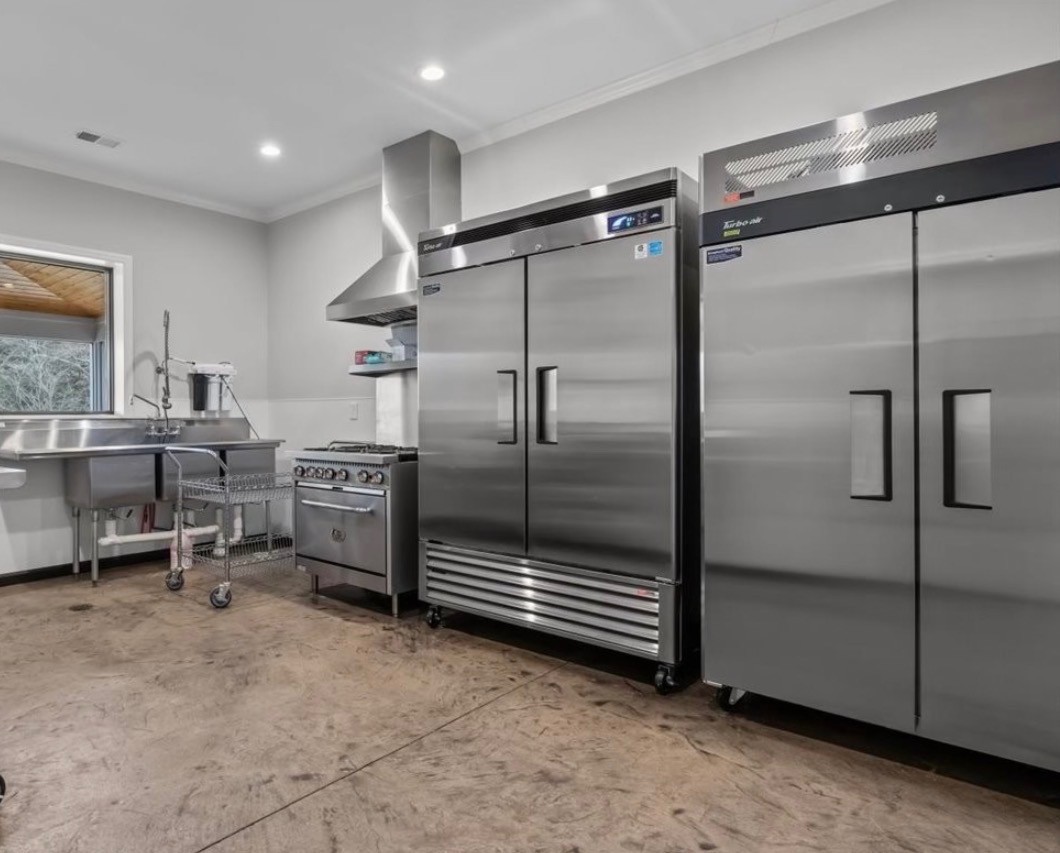 1355 Mitchell Road Pulaski, TN 38478 - Photo 32 of 95 a kitchen with refrigerator and table