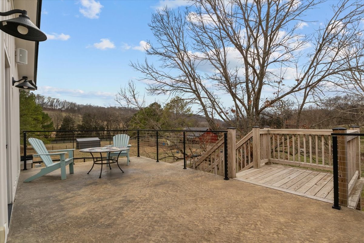 1355 Mitchell Road Pulaski, TN 38478 - Photo 56 of 95 a view of a chairs and tables in the back yard of the house