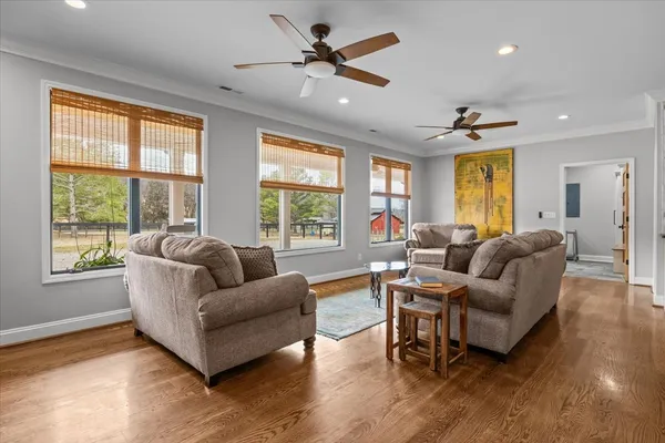 a view of a livingroom with furniture and a flat screen tv