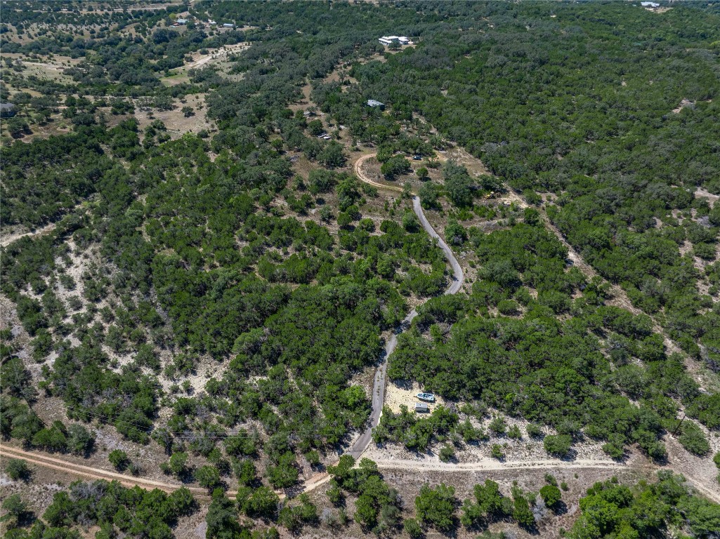 0 Post Oak Bend Loop Marble Falls, TX 78654 - Photo 9 of 18 a view of a house with a lush green forest