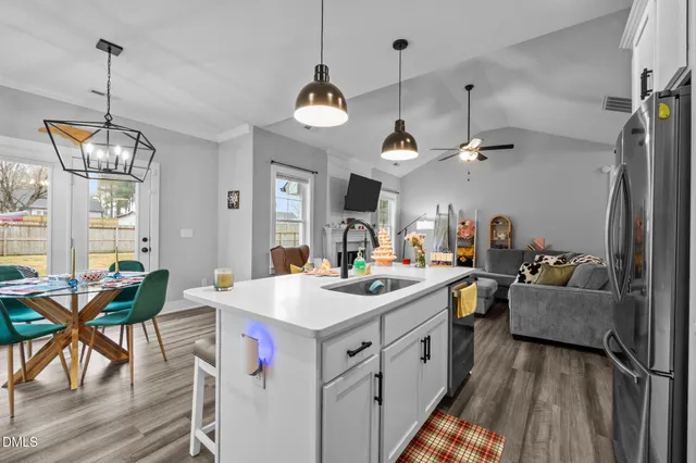 a kitchen that has a lot of cabinets in it