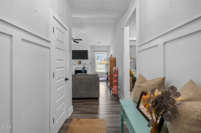 a kitchen with stainless steel appliances a refrigerator and a view of living room