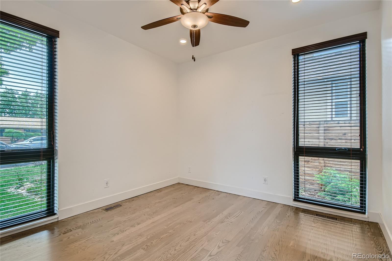 1609 Xavier Street Denver, CO 80204 - Photo 14 of 36 an empty room with windows and closet