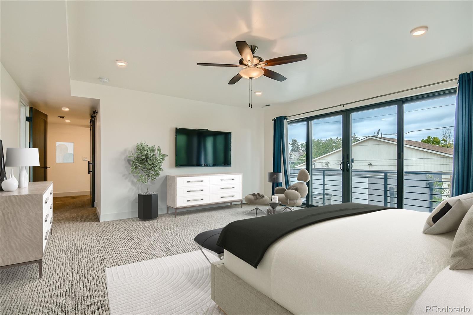 1609 Xavier Street Denver, CO 80204 - Photo 18 of 36 a bedroom with a large bed and a large window