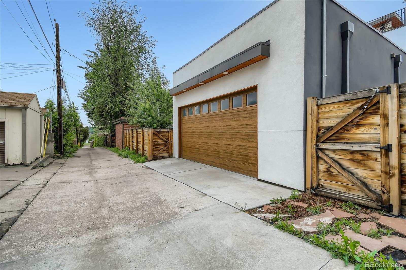 1609 Xavier Street Denver, CO 80204 - Photo 32 of 36 a view of a door and wooden fence