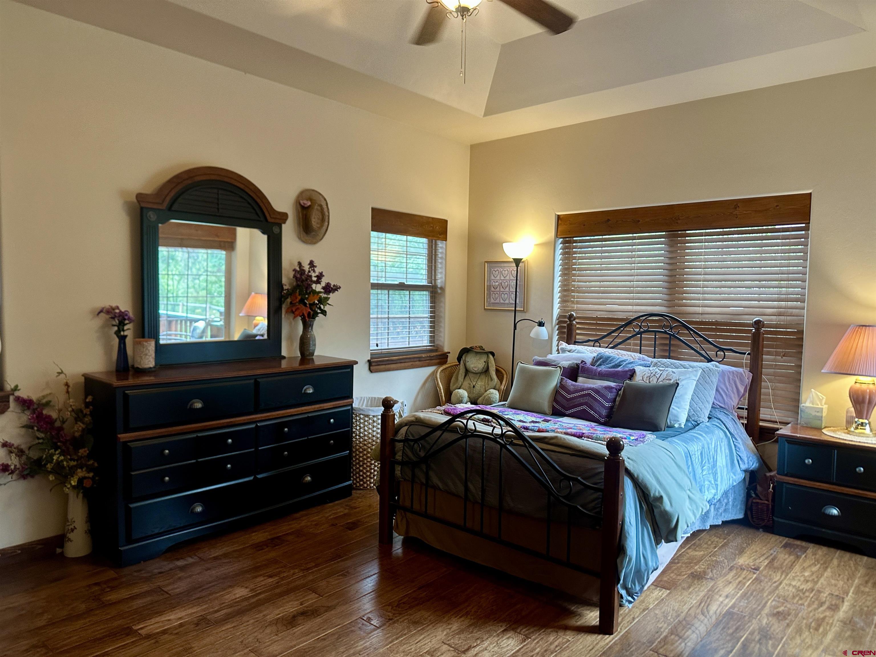 515 Southeast 2nd Street Cedaredge, CO 81413 - Photo 15 of 35 a bedroom with a bed window and dresser