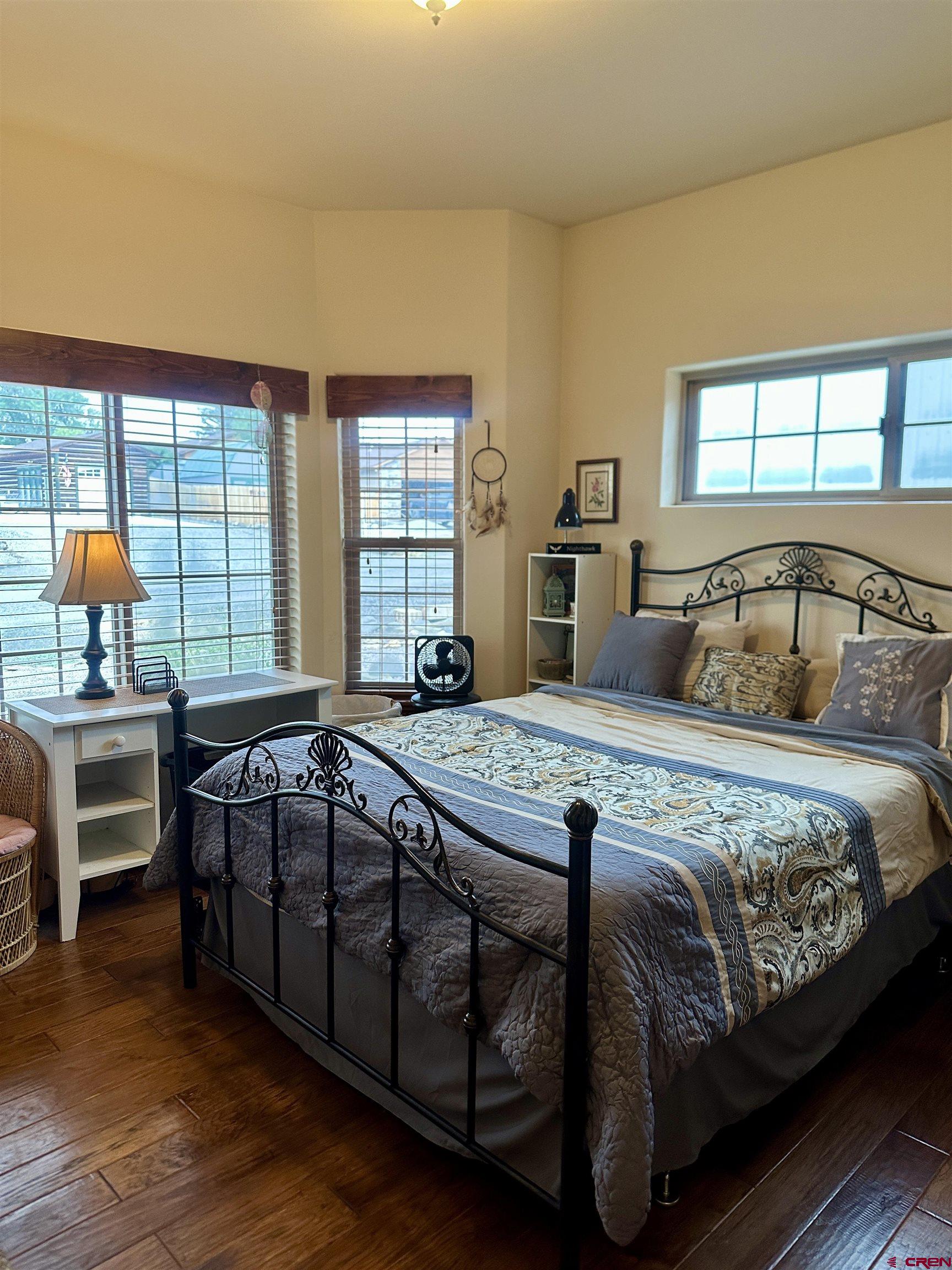 515 Southeast 2nd Street Cedaredge, CO 81413 - Photo 20 of 35 a bedroom with a bed and a window