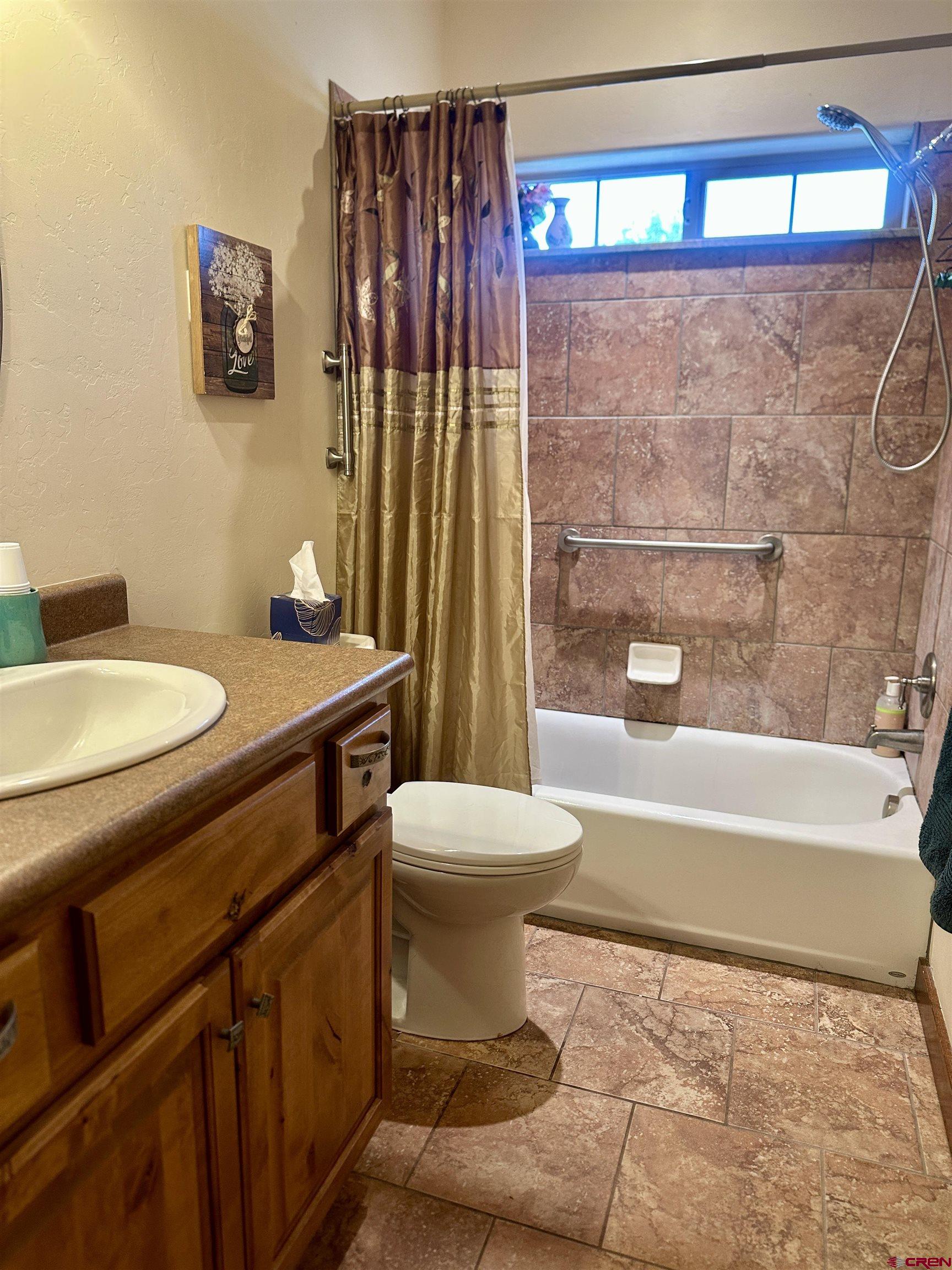 515 Southeast 2nd Street Cedaredge, CO 81413 - Photo 21 of 35 a bathroom with a sink toilet and shower
