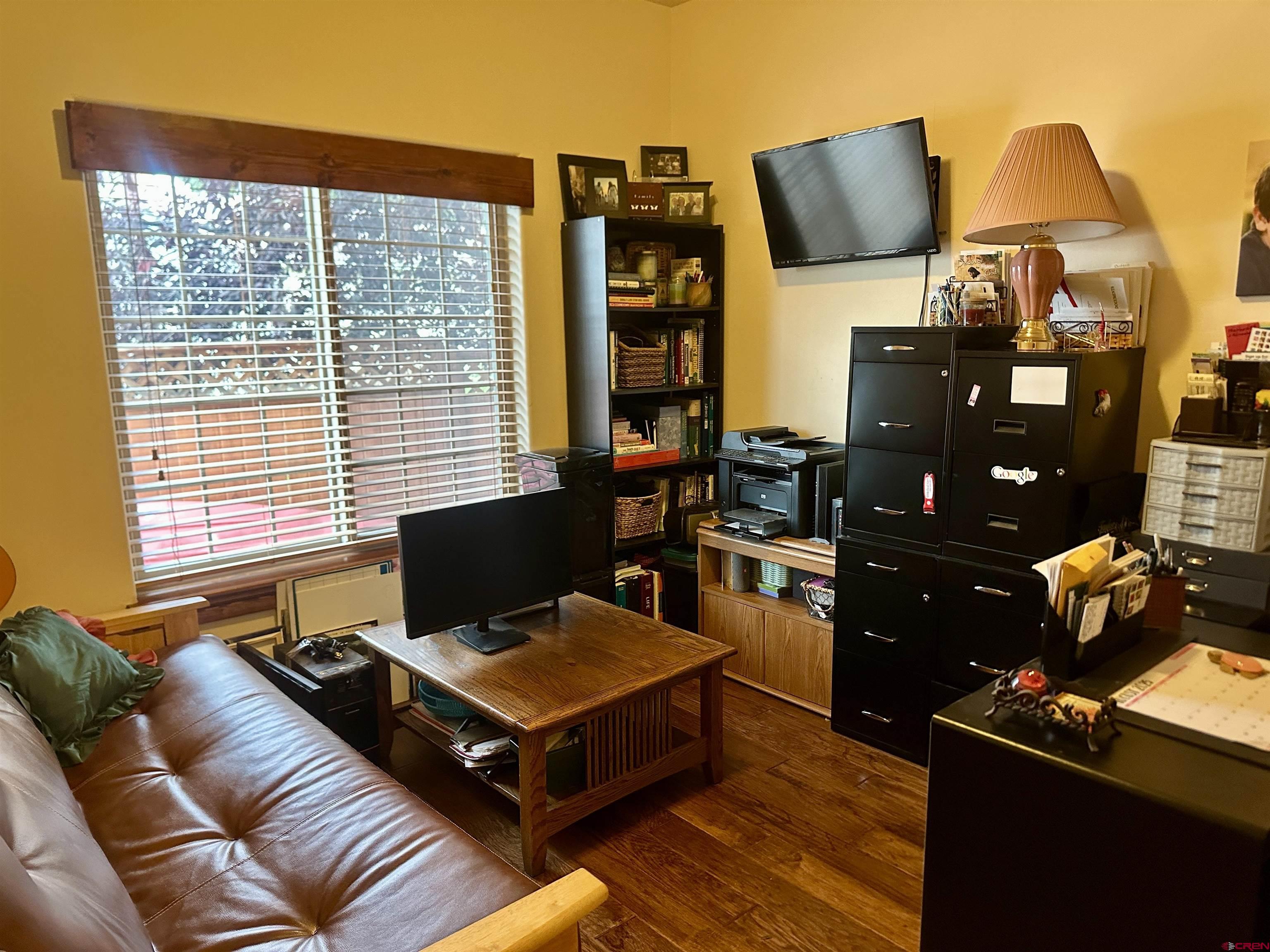 515 Southeast 2nd Street Cedaredge, CO 81413 - Photo 22 of 35 a living room with furniture and floor to ceiling window