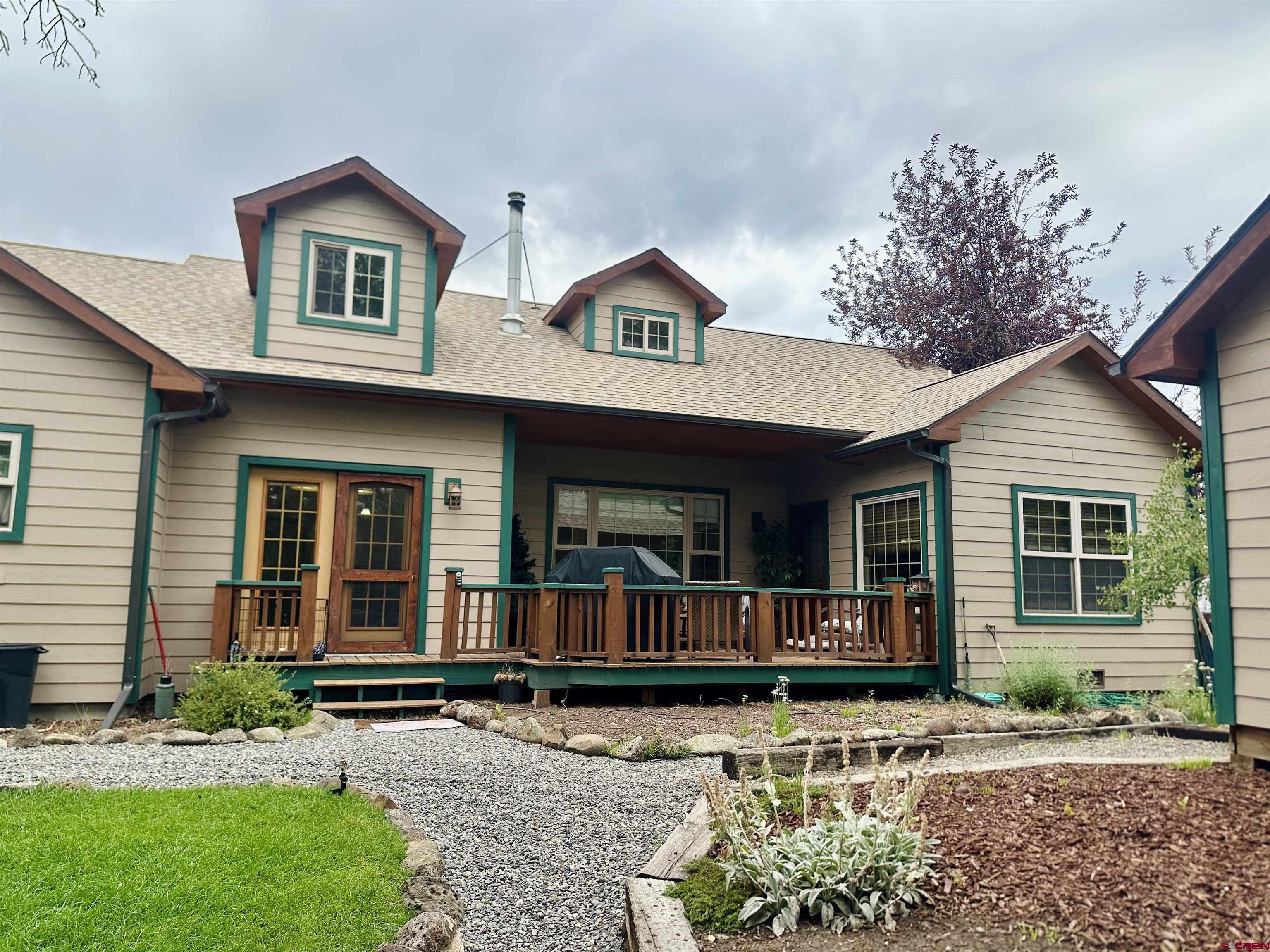 515 Southeast 2nd Street Cedaredge, CO 81413 - Photo 26 of 35 a front view of a house with garden
