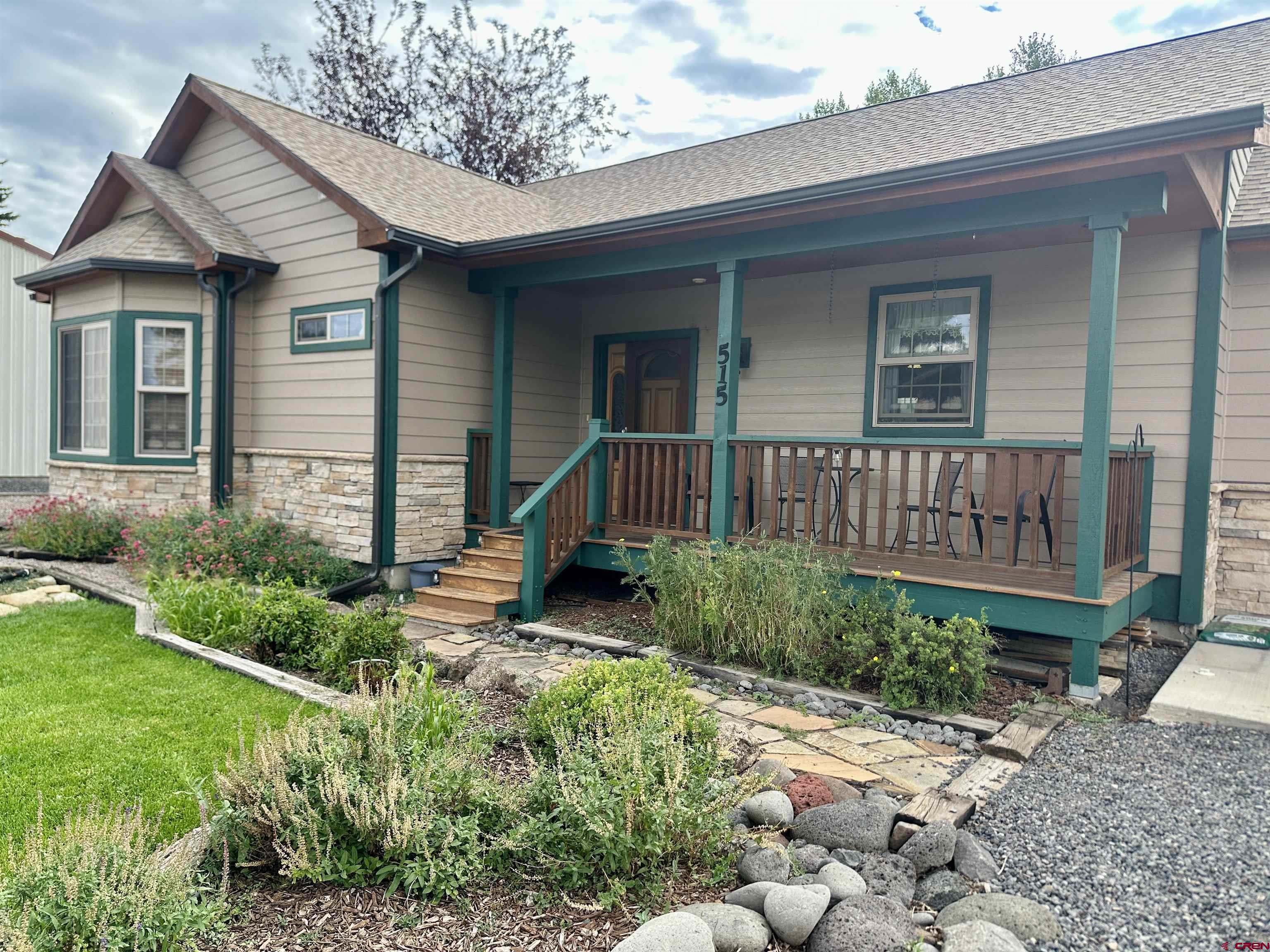 515 Southeast 2nd Street Cedaredge, CO 81413 - Photo 3 of 35 a view of a house with a yard and plants