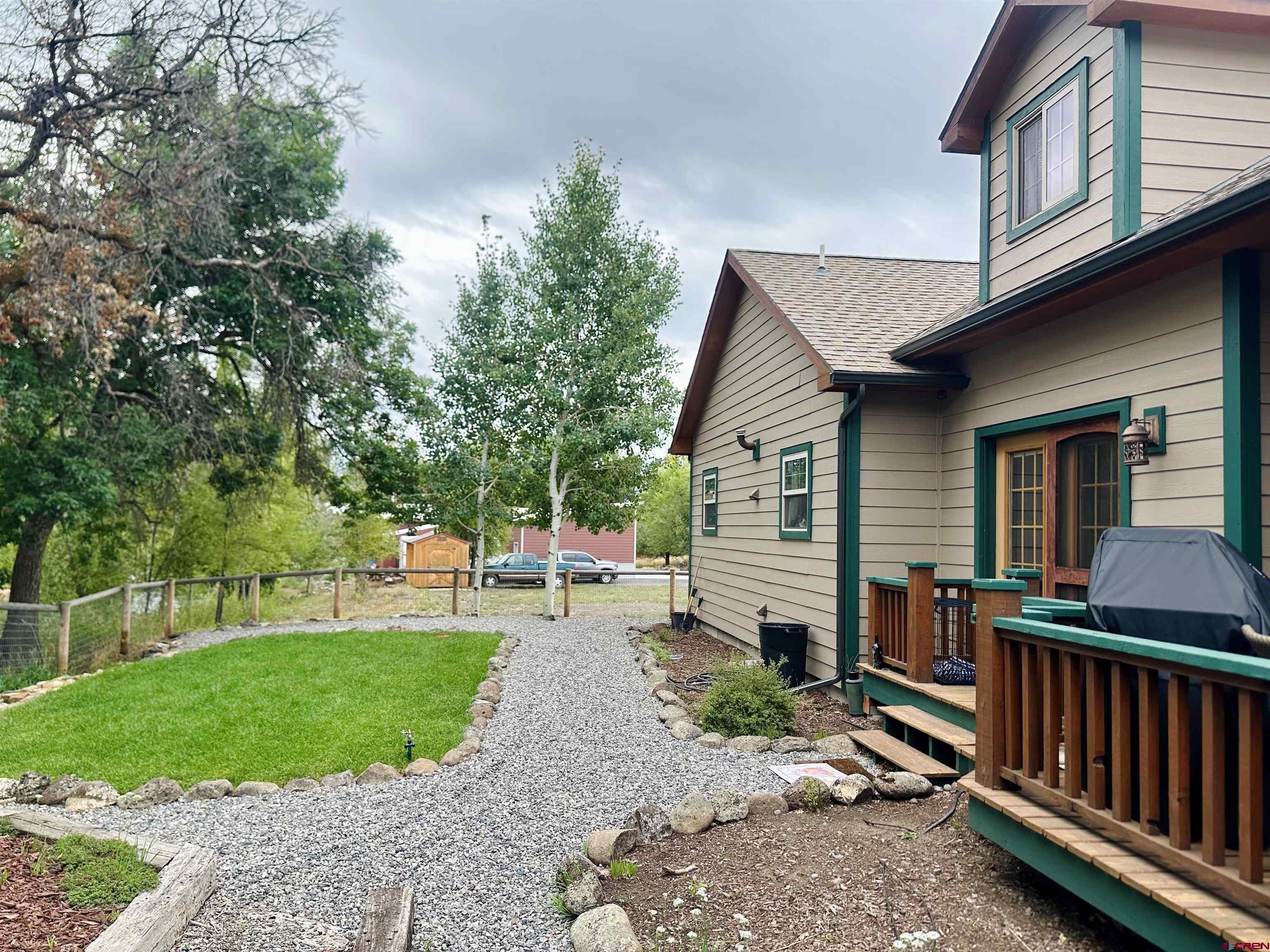 515 Southeast 2nd Street Cedaredge, CO 81413 - Photo 32 of 35 a front view of a house with garden