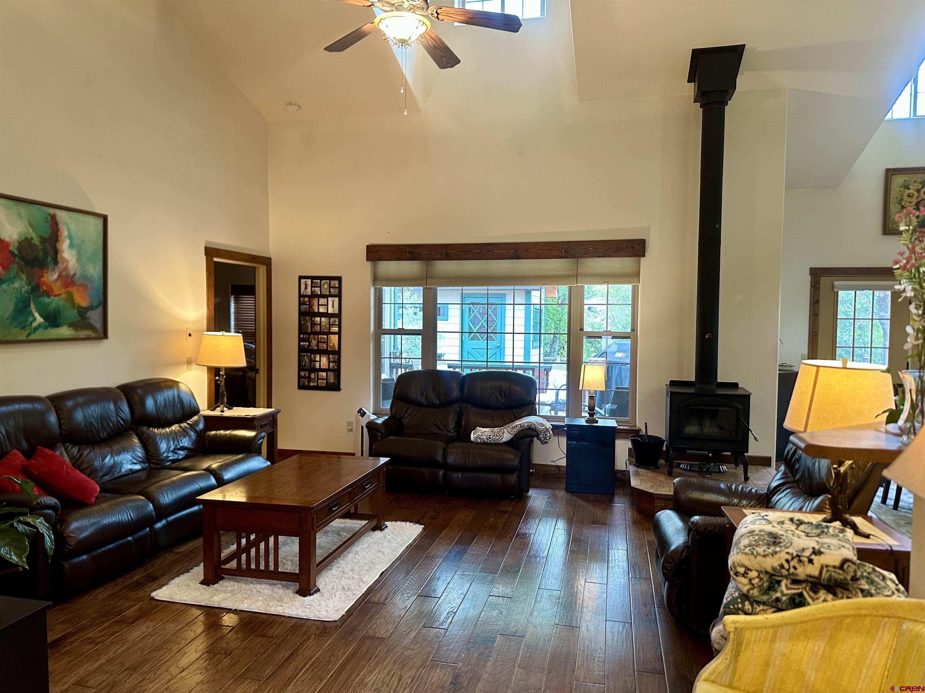 515 Southeast 2nd Street Cedaredge, CO 81413 - Photo 5 of 35 a living room with furniture and a fireplace