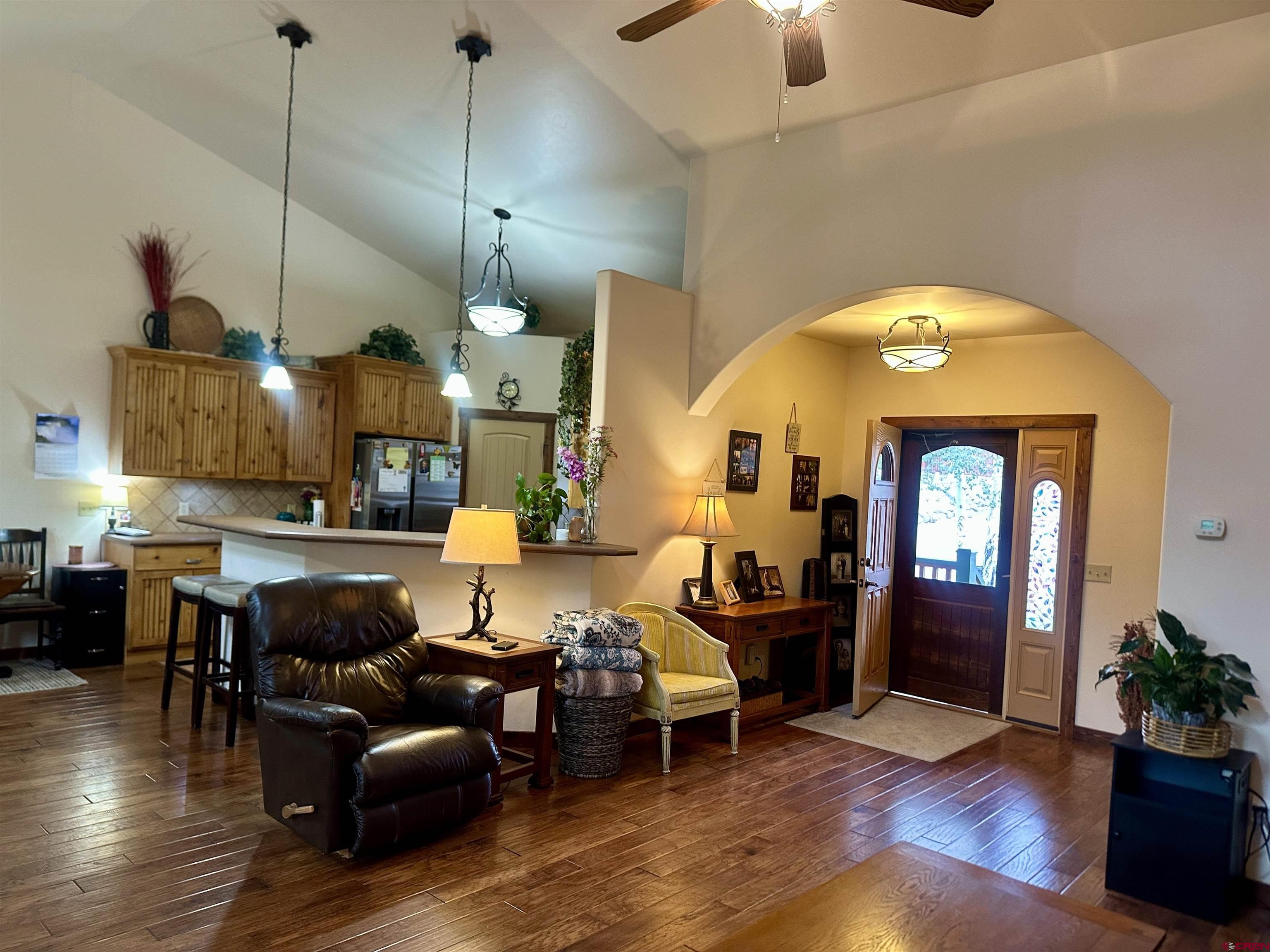 515 Southeast 2nd Street Cedaredge, CO 81413 - Photo 6 of 35 a living room with furniture and wooden floor
