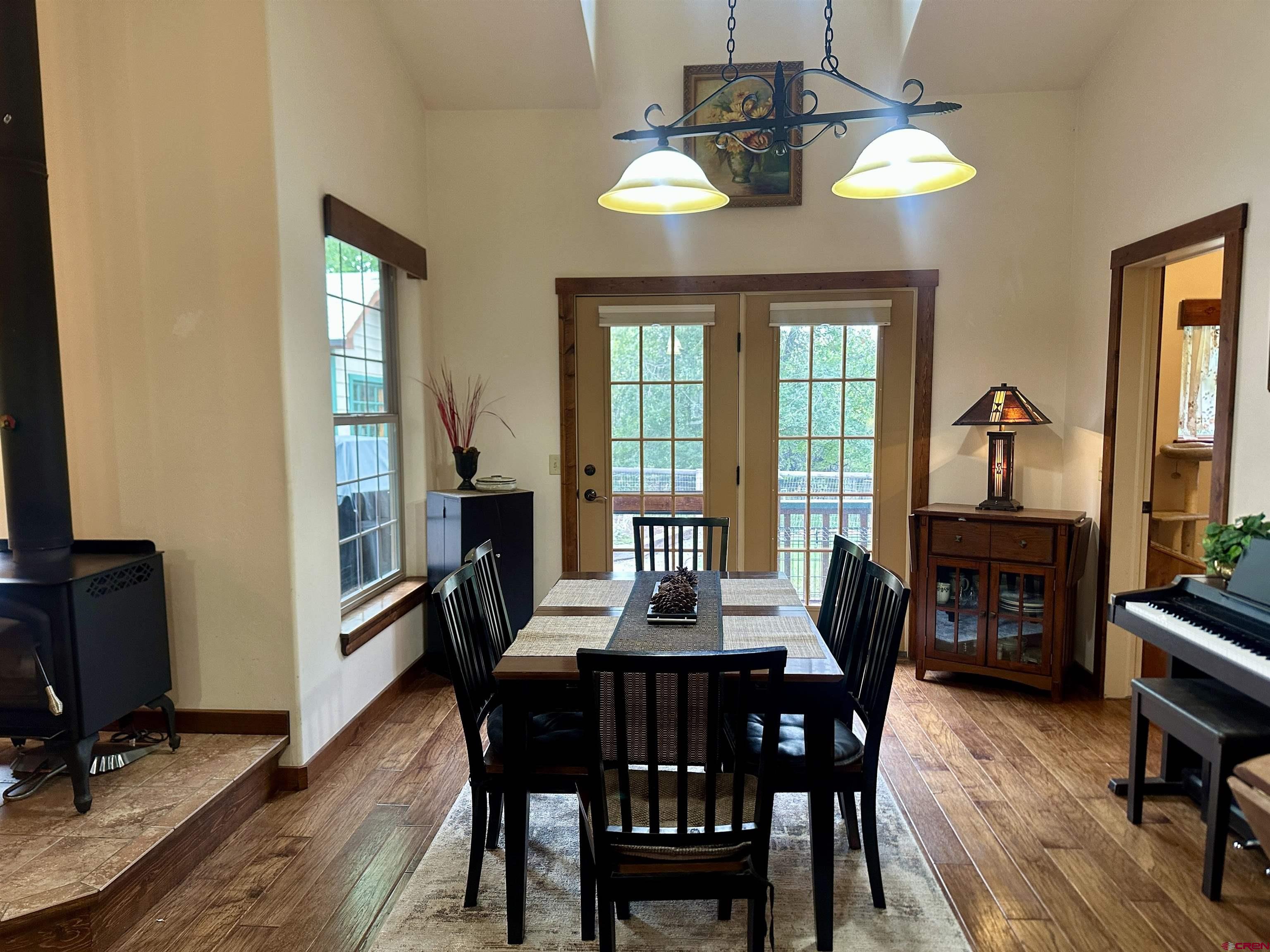 515 Southeast 2nd Street Cedaredge, CO 81413 - Photo 7 of 35 a view of a dining room with furniture window and wooden floor