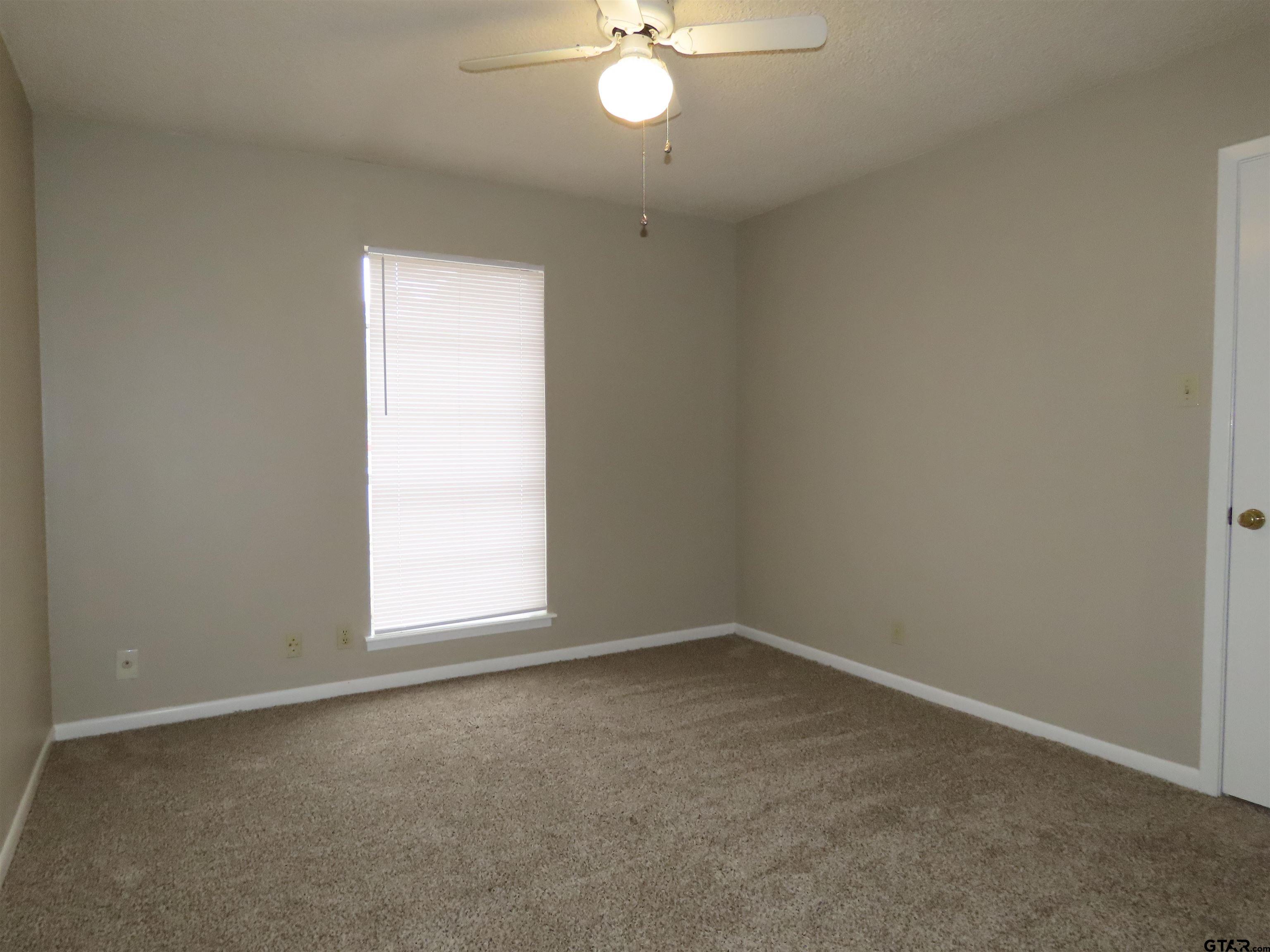 402 Muller Garden Road Tyler, TX 75703 - Photo 21 of 33 an empty room with a window