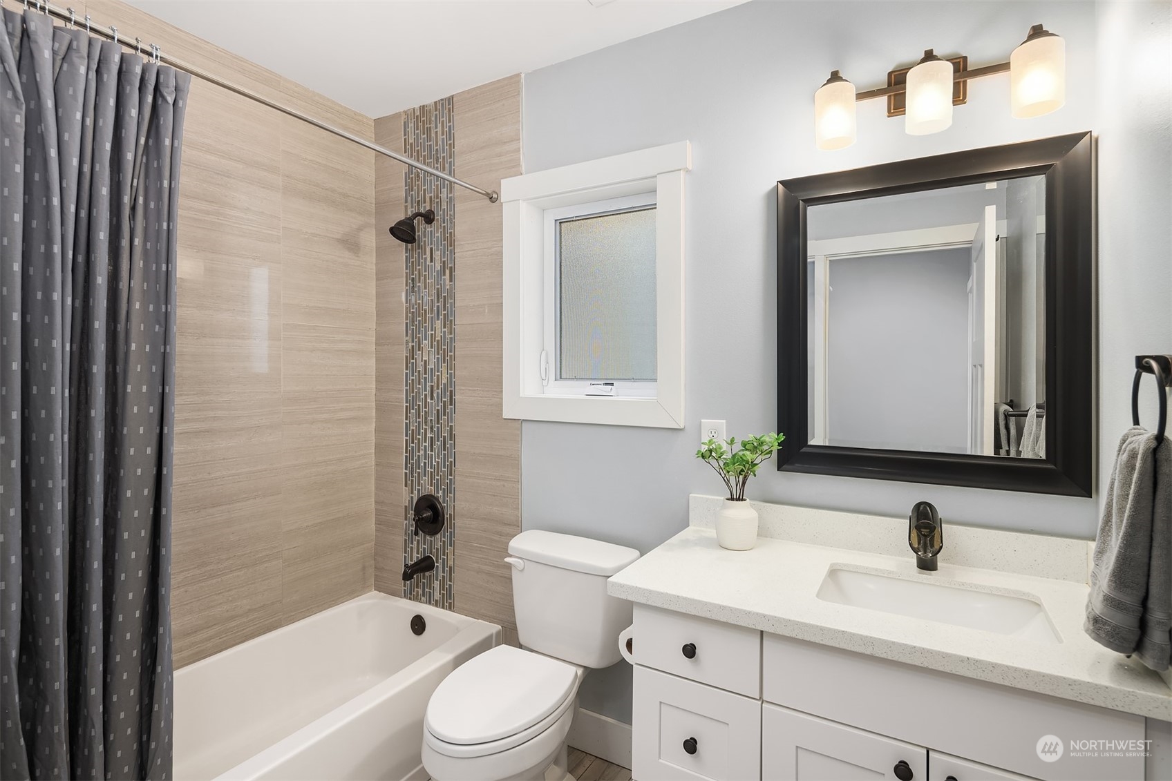 1112 North 76th Street Seattle, WA 98103 - Photo 18 of 40 a bathroom with a sink a toilet and shower