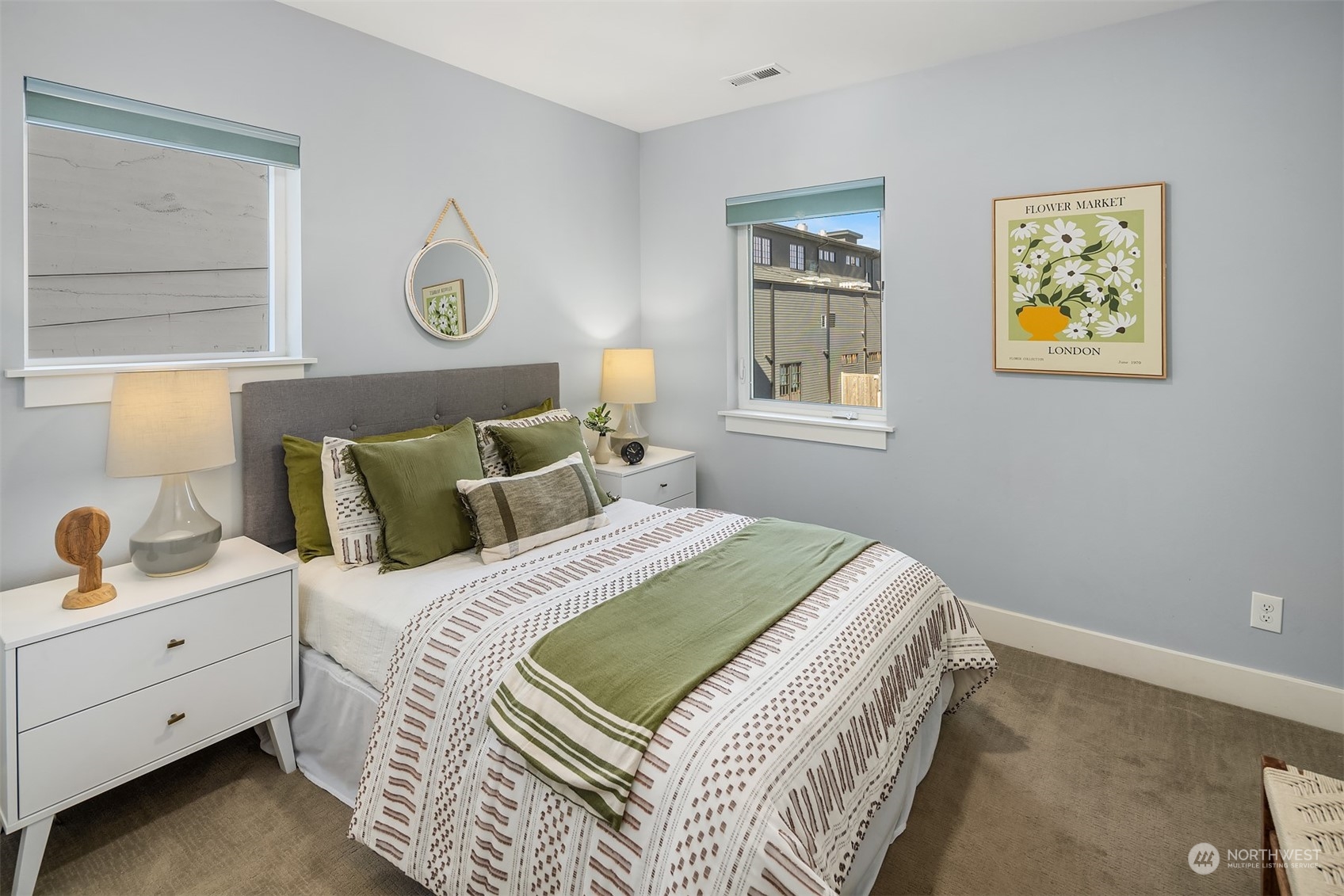 1112 North 76th Street Seattle, WA 98103 - Photo 23 of 40 a bed room with a bed and painting on the wall